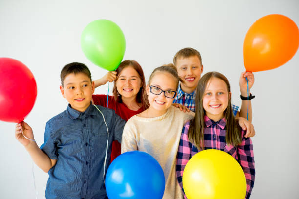 istock Happy children with balloons 840948844