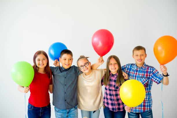 istock Happy children with balloons 840948870