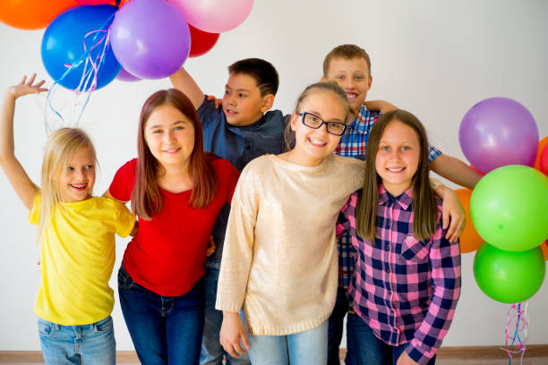 istock Happy children with balloons 840949448