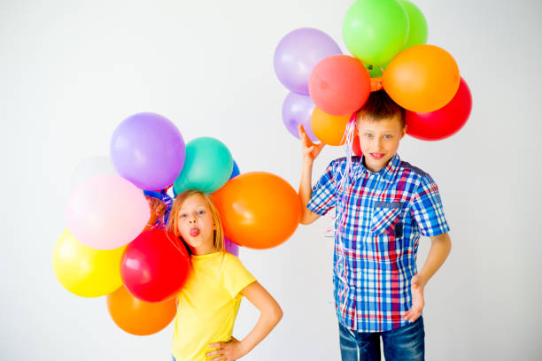 istock Happy children with balloons 840949568