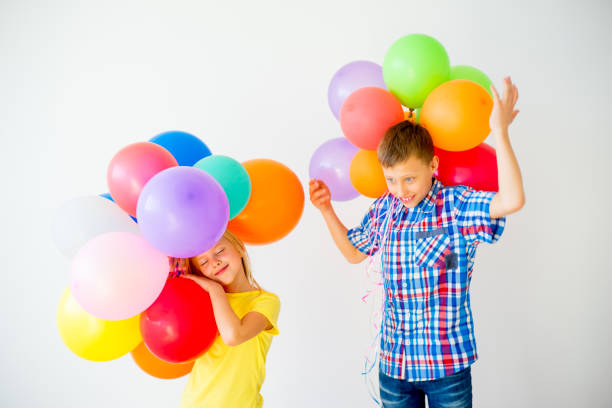 istock Happy children with balloons 840949614