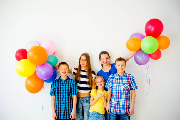 istock Happy children with balloons 840949842