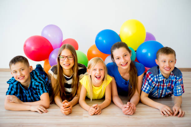 istock Happy children with balloons 840950086