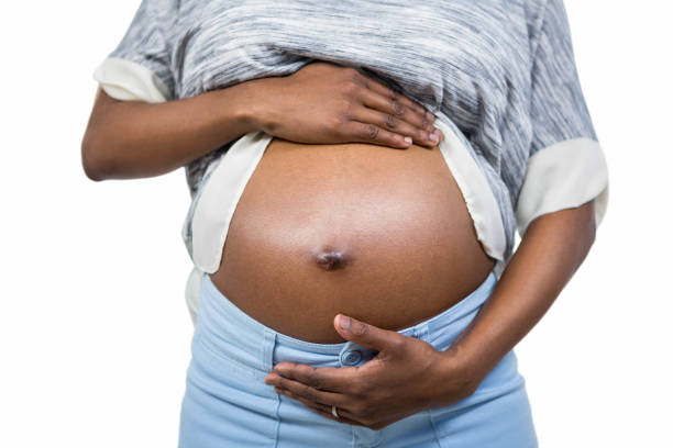 istock Pregnant woman touching her belly 840959678