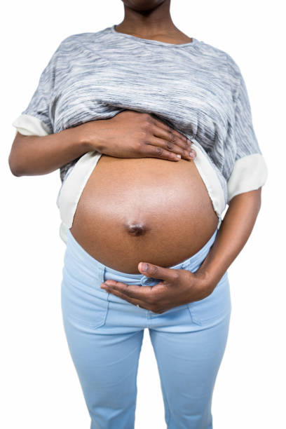 istock Pregnant woman touching her belly 840959694