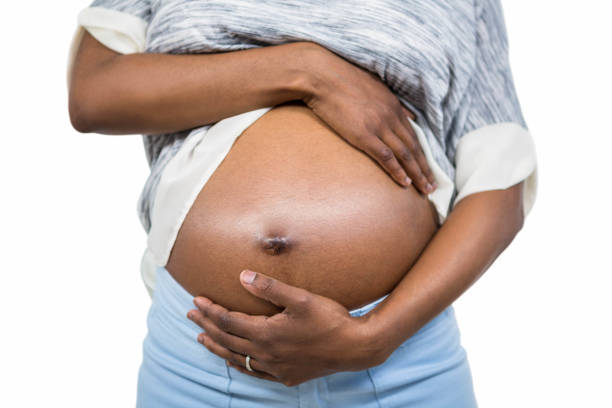 istock Pregnant woman touching her belly 840959710