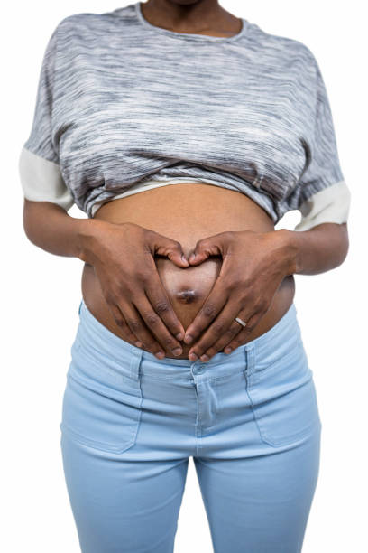 istock Pregnant woman touching her belly 840959772