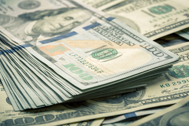 istock Lot of one hundred dollar bills close-up background 840960138