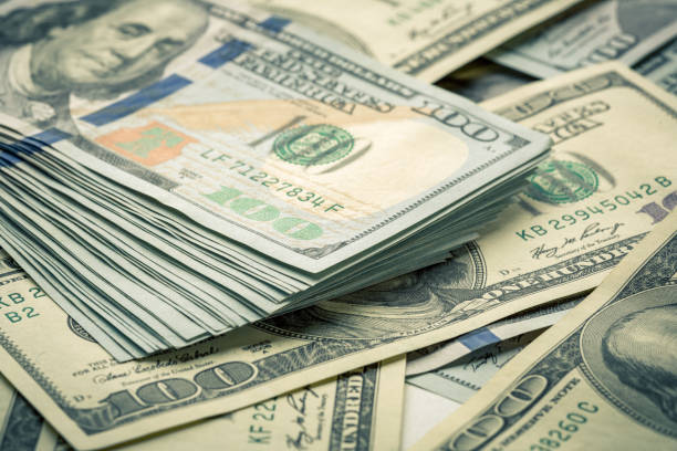 istock Lot of one hundred dollar bills close-up background 840960200