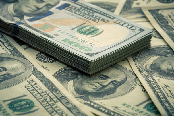 istock Lot of one hundred dollar bills close-up background 840960794