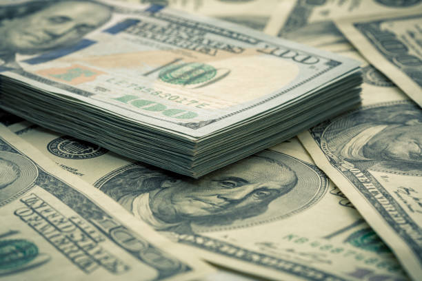 istock Lot of one hundred dollar bills close-up background 840960936