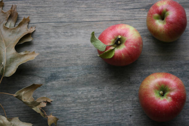 istock Fall season still life with apples over rustic wooden background 840961526