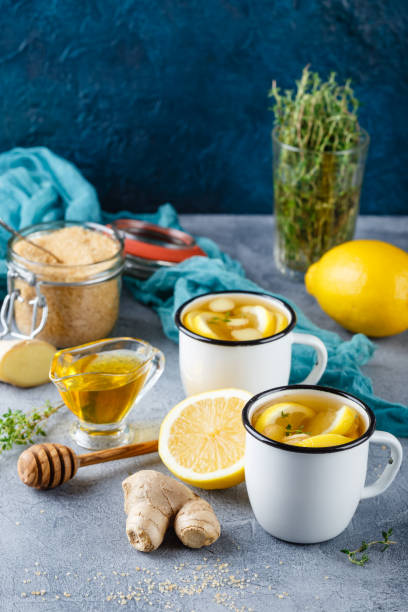 istock Cups of ginger tea with honey and lemon 840965232