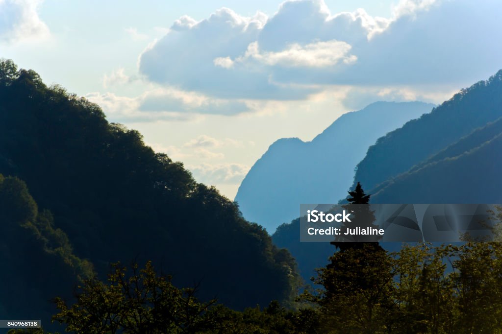 Picturesque landscape with Russian Caucasus mountains Summer picturesque landscape with Russian Caucasus rockies mountains with blue sky Caucasus Stock Photo