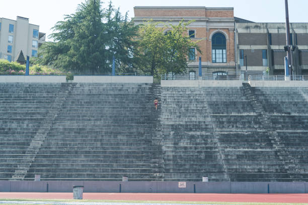 istock Female athlete working out at stadium field 840974358