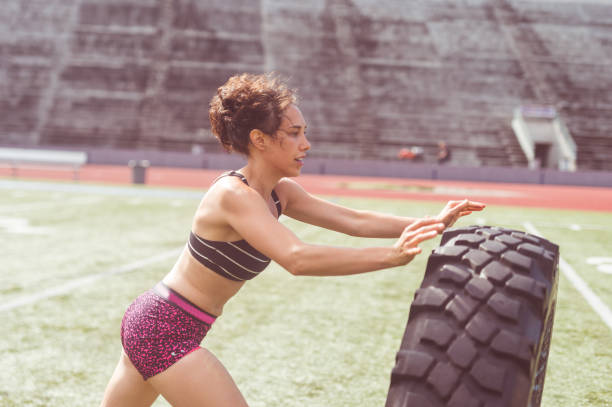 istock Female athlete working out at stadium field 840974372