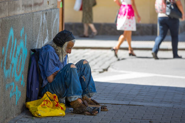 Sofia: Homeless old man with long white beard begs for money at the street. Ten years after joining the EU Bulgaria is still the poorest country in the union.