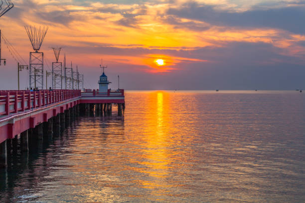 istock golden sky above light house. 840985442