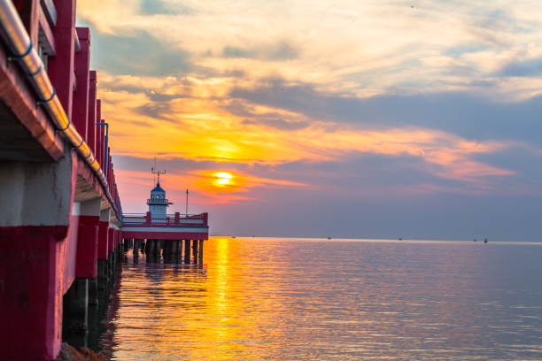 istock golden sky above light house. 840985512