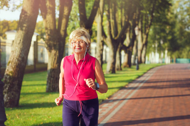 istock Active senior woman running 840985854
