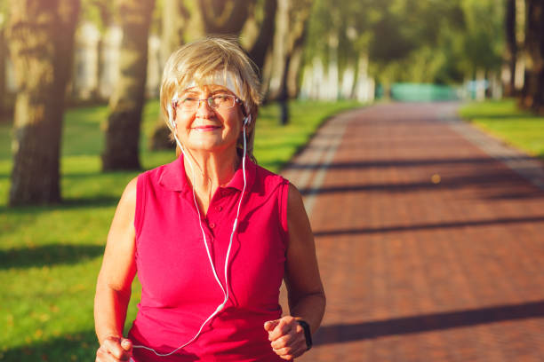 istock Active senior woman running 840985884