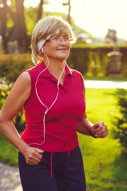 istock Active senior woman running 840985924