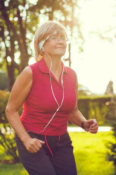 istock Active senior woman running 840985942