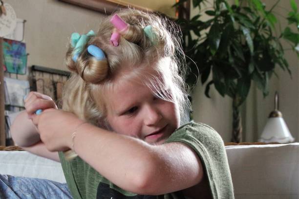 istock Girl doing here hair 840990050