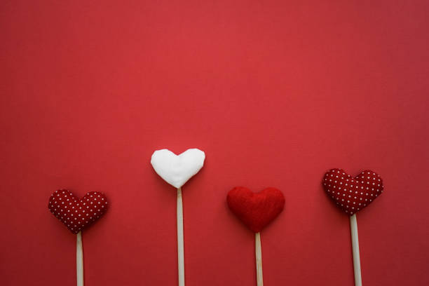 istock Colorful paper hearts on line 840990444