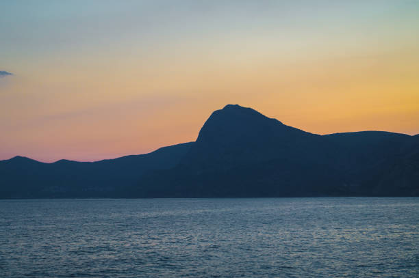 Evening landscape sunset over the Black Sea and Crimean Mountains