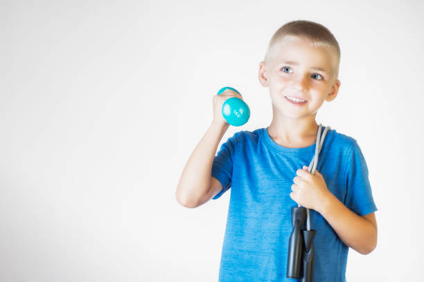 istock Boy with skipping rope and dumbbell. 840996918