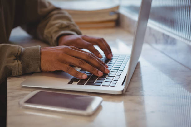 istock Cropped hands of businessman using laptop 840998244