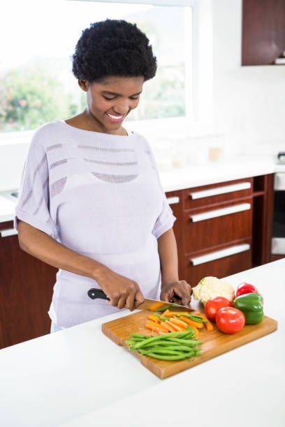 istock Pregnant woman preparing vegetables 841001522