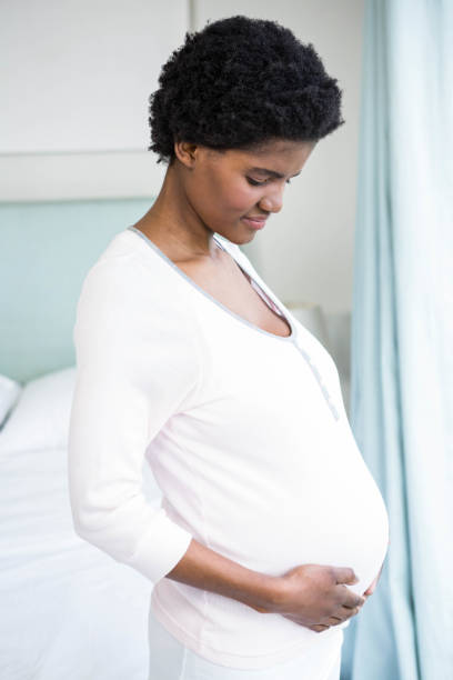 istock Pregnant woman touching her belly 841001714