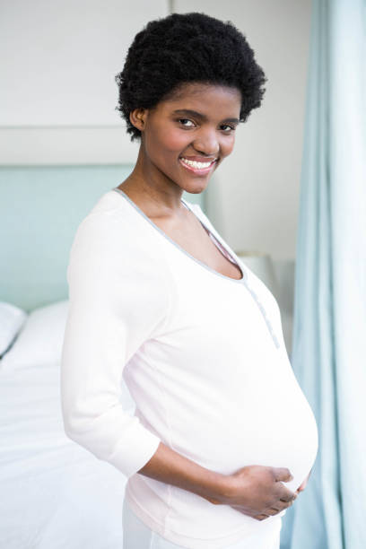 istock Pregnant woman touching her belly 841001734