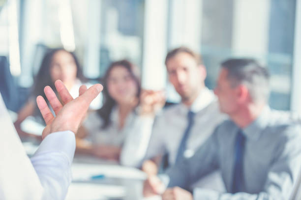 group of people listening to a presentation. - business conference meeting teamwork imagens e fotografias de stock