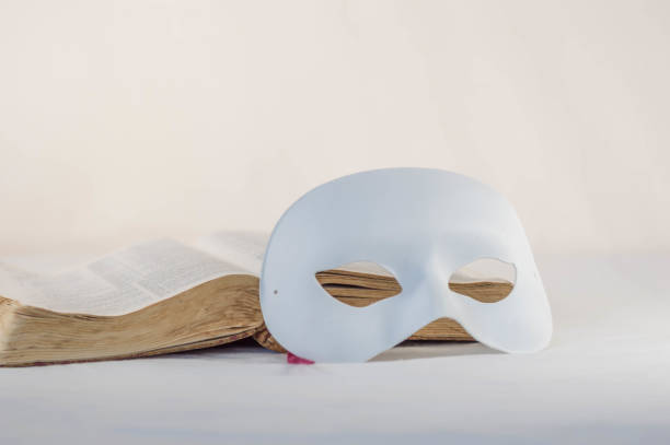 istock Mask in front of an old Bible 841020088