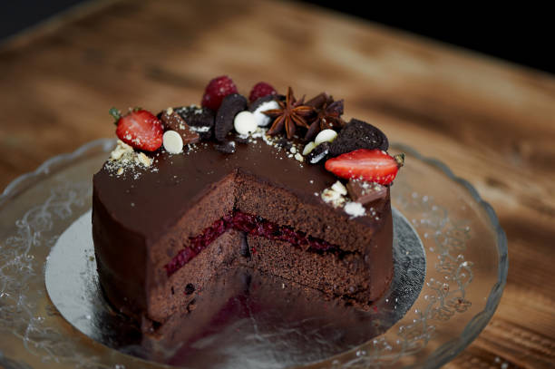istock The chocolate cherry cake, decorated with strawberries, biscuits and strawberry shortcake. A masterpiece of culinary art 841020090