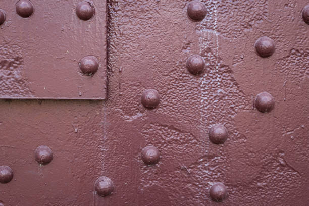 istock Closeup of red rivets 841020390