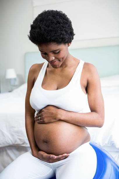 istock Pregnant woman rubbing her belly 841026722