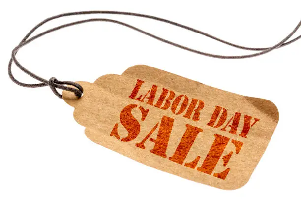 Labor Day sale sign - a paper price tag with a twine isolated on white