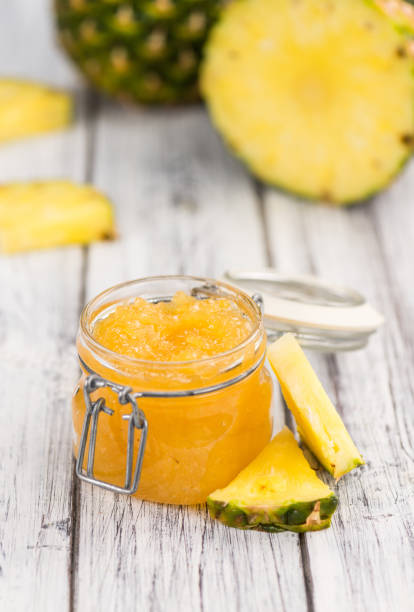 istock Pineapple Jam on vintage wooden background 841029896