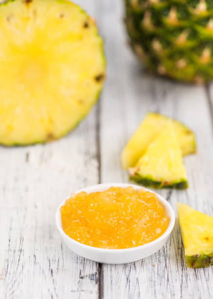 istock Pineapple Jam on vintage wooden background 841029980