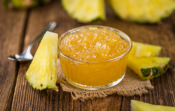 istock Pineapple Jam on vintage wooden background 841030056