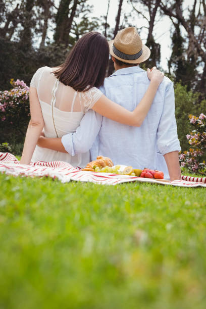 istock Young couple embracing outdoors 841030252