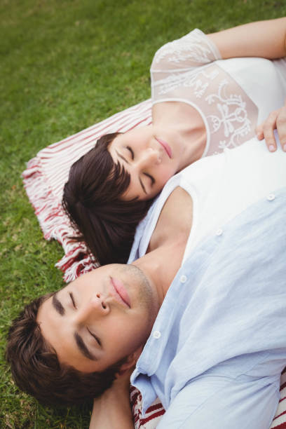 istock Young couple relaxing on blanket 841030312