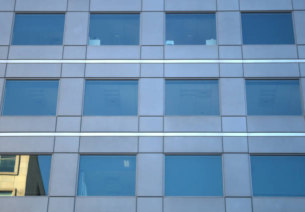 istock business office building glass window reflections mirror skyscraper 841037456
