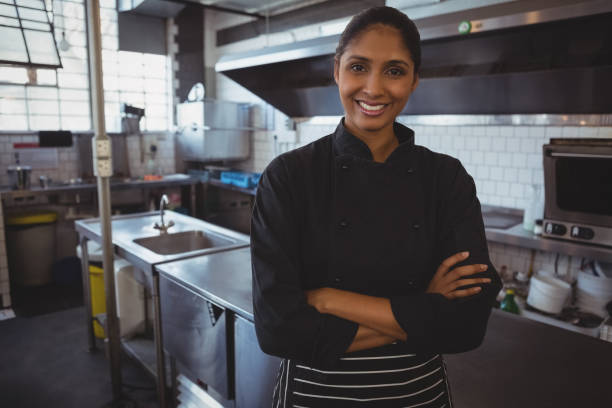 istock Portrait of waitress standing in cafe 841037976