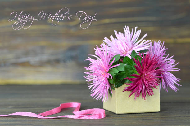 istock Happy Mothers Day card with flowers arranged in gift box 841040292