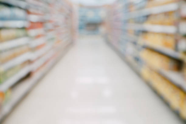istock Abstract supermarket aisle shelves blurred background 841044900